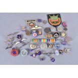 An assortment of sweetheart brooches and badges, to include a silver and tortoiseshell R.N.V.R, a