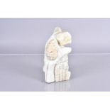 A carved soapstone figure, in the Inuit style, AF, with carved signature to the base Colin **andy,