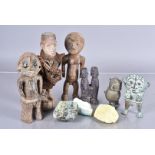 An assortment of Tribal figures, to include a Nail Fetish figure, a wooden couple figure, a scent