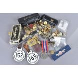 An assortment of items, to include a British WWI War medal, a selection of Naval buttons and badges,