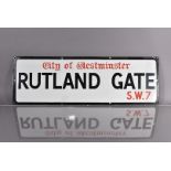 A City of Westminster enamel road sign, for Rutland Gate, S.W.7, black and red lettering on white
