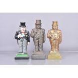 Three vintage Winston Churchill doorstops, including a brass and two iron examples, all of the