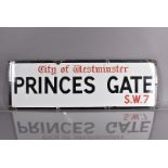 A City of Westminster enamel road sign, for Princes Gate, S.W.7, black and red lettering on white