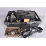 An assortment of various items, to includ, military head sets, various belts, holsters and other