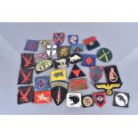 An assortment of cloth badges, to include Desert Rats, three 4th Indian Infantry Division printed