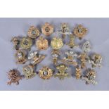 A collection of Hussars cap badges, comprising 10th Royal Hussars, 11th Hussars, 12th Royal Lancers,