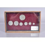 Mid-19th Century framed and glazed Display of metal East Sussex Hop Tokens, issued by John Pinyon,