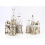 Two Victorian silver and cut glass cruet sets by GF, each pierced stand with handle and having