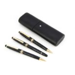 A set of two modern Montblanc pens and a pencil, used, presented in a black leather three pen pouch,
