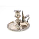 A William IV silver chamberstick by IS HW, 10.9 ozt, 15cm diameter, having engraved crest to well,