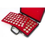 A collection of modern British coins, presented in a small brief case with six coin trays, two