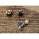 A sapphire pear shaped yellow metal pendant, together with two sapphire stud earrings, 2g