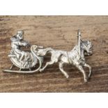 A Russian white metal Troika sleigh brooch, the single horse pulling a sleigh, marked to clasp 900