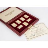 A 1970s commemorative silver gilt stamp ingot set from Hallmark Replicas, in fitted red box with
