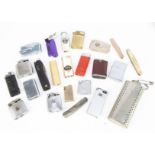 A collection of lighters and pocket knives, including a gold plated pocket knife, an antler knife, a