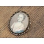 An 18th Century portrait miniature on ivory within gilt metal oval frame of a young girl, with