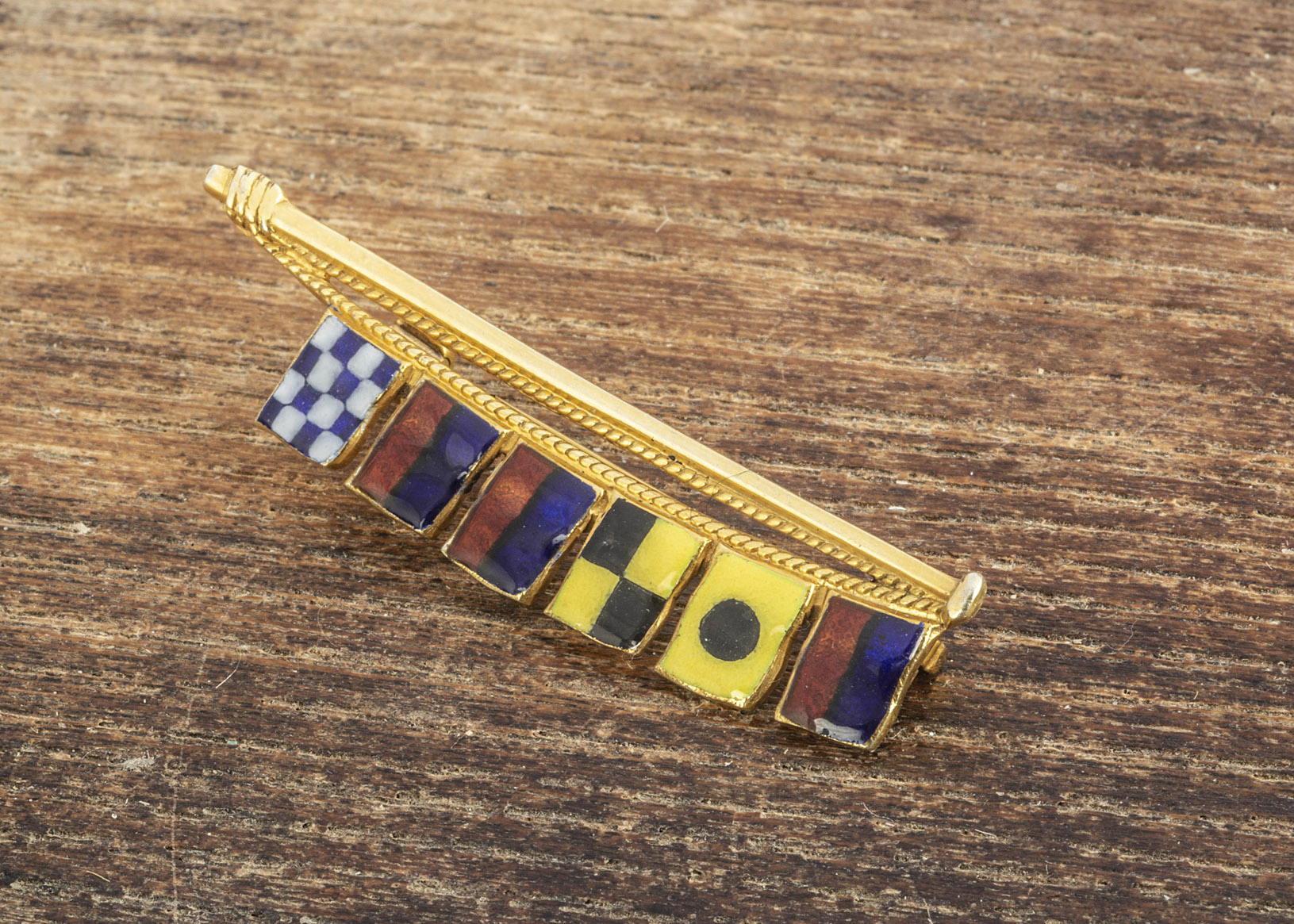 A 9ct gold enamel semaphore brooch spelling Eileen, 4.1cm, 4.8g