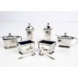 An Art Deco period silver six piece cruet set by Goldsmiths & Silversmiths