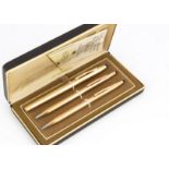 A Cross set of pens and pencil, in Cross box, gold plated with fibre tip, biro and retractable