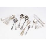 A small group of silver flatware and utensils, including a stilton scoop from Mappin & Webb, a