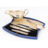 A 1950s cased silver fountain pen and pencil and pocket knife set, together with a small silver