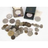 A small collection of coins and more, including an 1821 crown, an 1806 half penny, and more, also