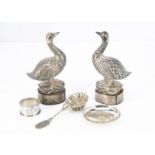 A pair of Art Deco period Far Eastern silver plated geese, AF, on wooden bases with applied plaques,