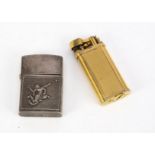 A modern Thai silver Zippo style cigarette lighter and a Dunhill gilt lighter