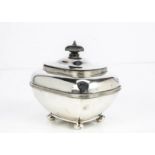 An Edwardian silver tea caddy by Goldsmiths & Silversmiths, 9.36 ozt, lid bent and dented, with