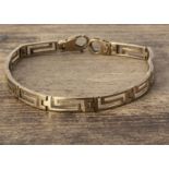 A 9ct gold open worked Greek Key bracelet, of pierced design, with snap clasp, 19 cm long 0.5 cm