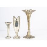 An Edwardian silver trumpet vase by Walker & Hall, 25cm and 11.6 ozt, together with two silver