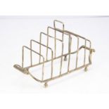 An interesting toast rack, with twin handles and seven dividing bars, 6.6 ozt, 21cm wide