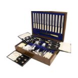 A mid 20th century canteen of cutlery by James Dixon & Sons, in an oak box, some paint to one