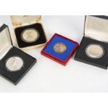 Four commemorative medallions, including a George V silver jubilee silver medal in card box, two