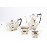 An Edward VII silver four piece tea set by William Hutton & Sons, 64.8 ozt, the teapot and coffee