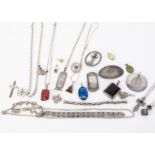 A collection of silver necklaces and pendants, including Mexican, Egyptian, craft made, gem set,