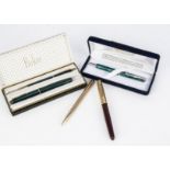 A boxed Parker 17 fountain pen and pencil set, together with a gold plated Yard O Led biro, a Parker