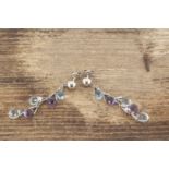 A pair of 18ct white gold chandelier amethyst and topaz ear drops, the faceted pear shaped ear drops