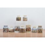 A collection of nine Staffordshire Prattware transfer printed pots, of varying styles and styles,