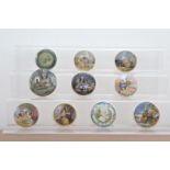 A collection of 19th century Staffordshire ceramic Prattware pot lids, of varying styles and