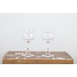 Twelve Baum Cristal shaped wine glasses, Daum France' marked to the bases, each 13.5cm high in the