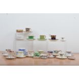 A large collection of porcelain tea cups and saucers, from a variety of makers, including Royal