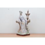 A large Lladro ceramic figurine, of a Japanese lady leaning with a lantern and holding a mirror,