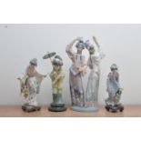 Four Lladro ceramic figurines, three of Japanese women, two with umbrellas, the tallest 31cm high,