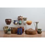 A collection of studio pottery, including stoneware and earthenware examples, jugs, vases, etc of