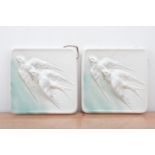 A pair of ceramic plaques, with raised bird designs, one badly damaged, '31' impressed to the backs,