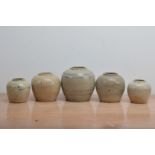 Five antique Chinese graduated stoneware ginger jars, with wear commensurate with age and use, the