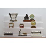 A collection of French desk items, comprising art deco style calendars, some on marble bases, two in