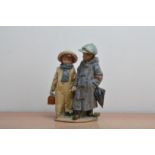 A Lladro ceramic figural group, of two children holding hands, printed and impressed marks to the