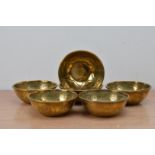 A set of six early 20th century brass middle eastern bowl, with decorated exterior and interiors